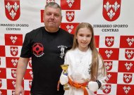 Čempione tapusi Liepa Butkutė kartu su treneriu A. Enčeriu.